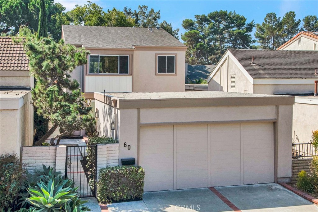 60 Willow Tree Lane Irvine, CA 92612 - Photo 2 of 74 a front view of a house with a yard