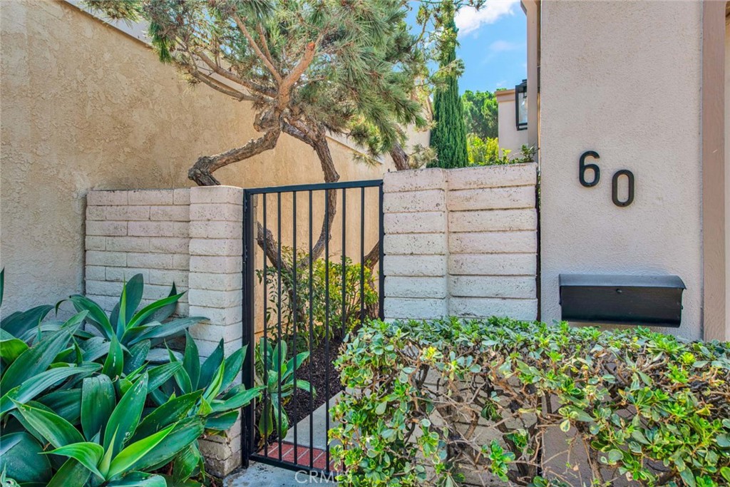 60 Willow Tree Lane Irvine, CA 92612 - Photo 3 of 74 a backyard of a house with lots of green space