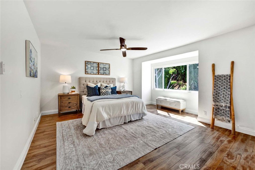 60 Willow Tree Lane Irvine, CA 92612 - Photo 32 of 74 a spacious bedroom with a large bed and a window