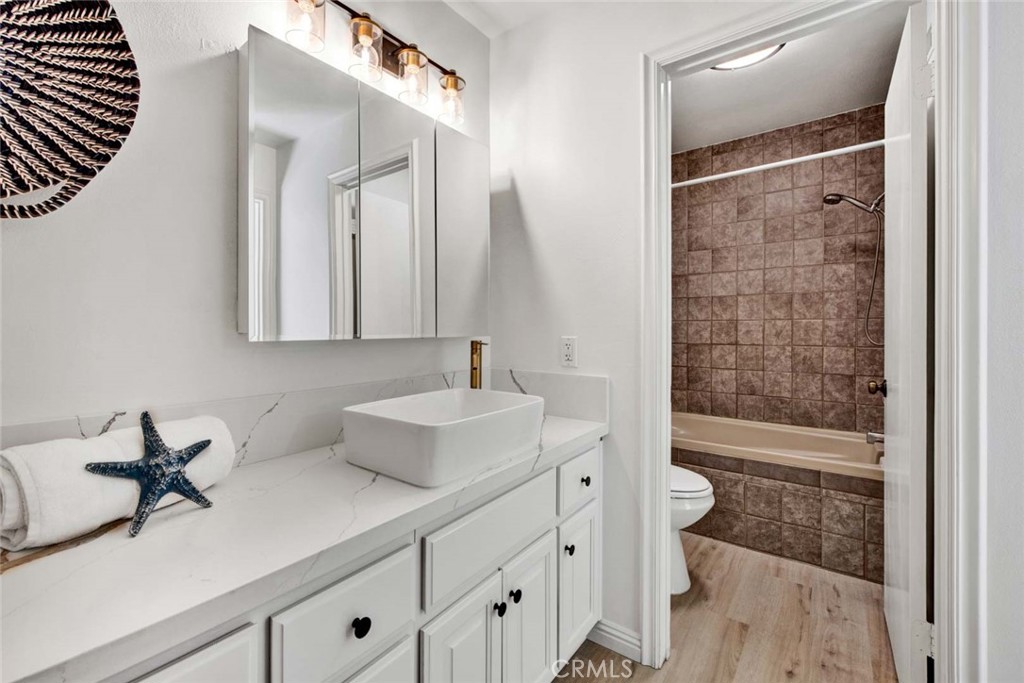 60 Willow Tree Lane Irvine, CA 92612 - Photo 37 of 74 a bathroom with a double vanity sink toilet and shower