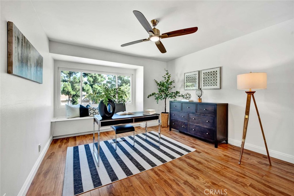 60 Willow Tree Lane Irvine, CA 92612 - Photo 41 of 74 a living room with furniture and a wooden floor