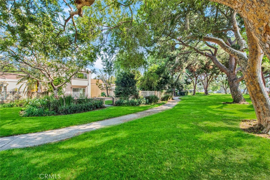 60 Willow Tree Lane Irvine, CA 92612 - Photo 50 of 74 a front view of a house with a yard