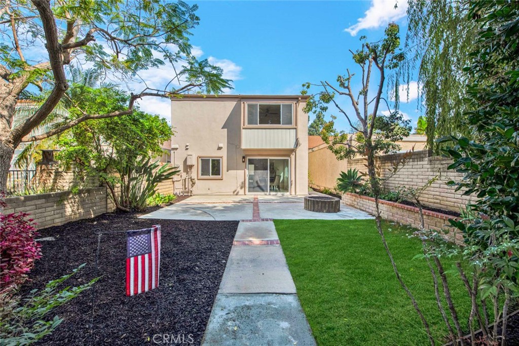 60 Willow Tree Lane Irvine, CA 92612 - Photo 54 of 74 a front view of a house with a yard