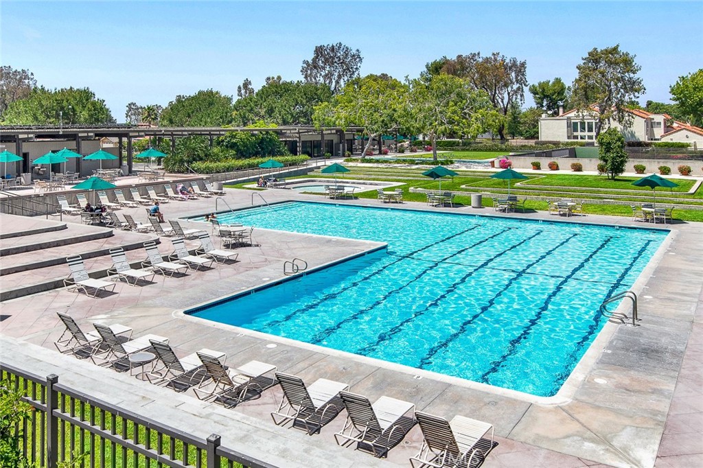 60 Willow Tree Lane Irvine, CA 92612 - Photo 67 of 74 a view of a swimming pool with a yard