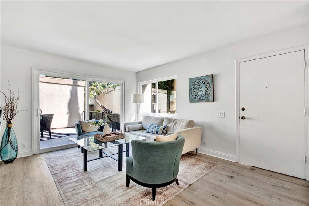 60 Willow Tree Lane Irvine, CA 92612 - Photo 7 of 74 a living room with furniture and a potted plant