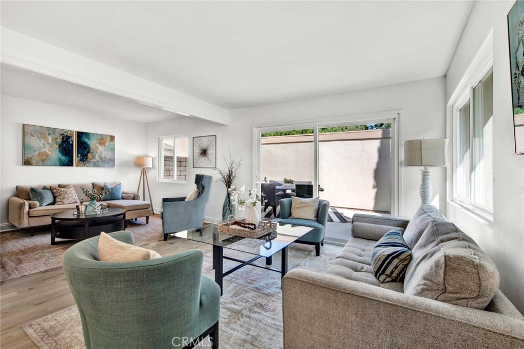 60 Willow Tree Lane Irvine, CA 92612 - Photo 8 of 74 a living room with furniture and a large window