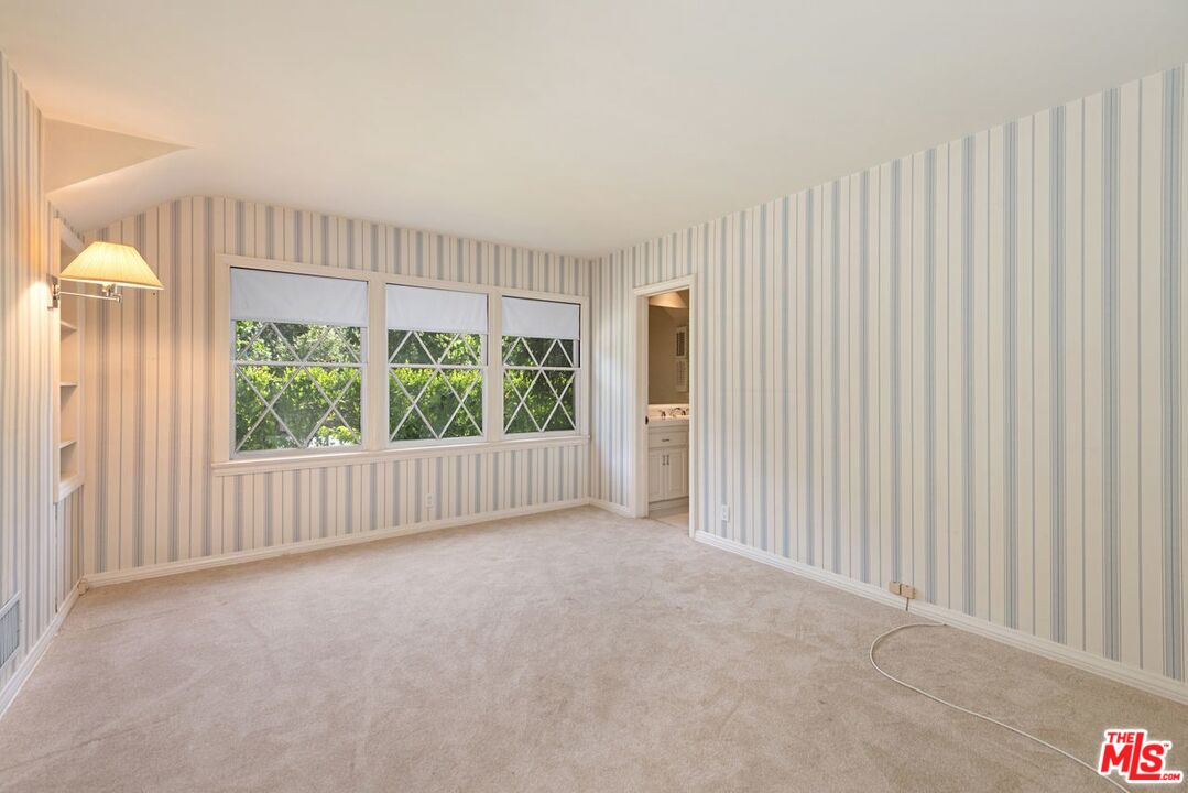 791 North Bundy Drive Los Angeles, CA 90049 - Photo 20 of 33 a view of an empty room with a window