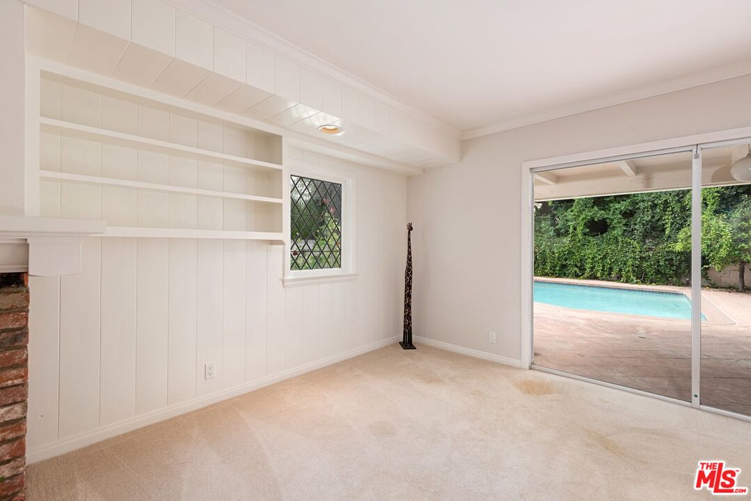 791 North Bundy Drive Los Angeles, CA 90049 - Photo 24 of 33 a view of an empty room with a window