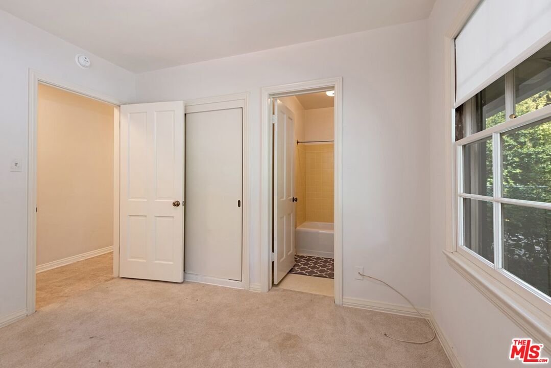 791 North Bundy Drive Los Angeles, CA 90049 - Photo 30 of 33 an empty room with windows