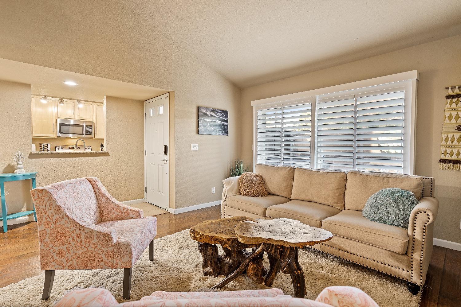 6235 Riverside Boulevard, Unit 2 Sacramento, CA 95831 - Photo 6 of 17 a living room with furniture and a large window