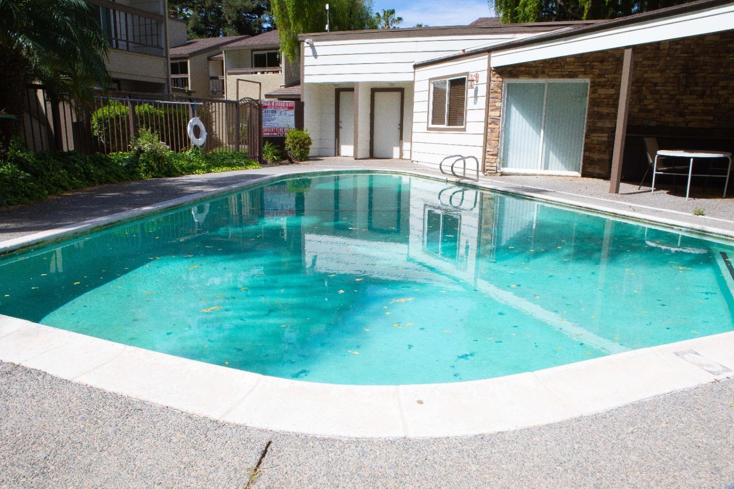 6235 Riverside Boulevard, Unit 2 Sacramento, CA 95831 - Photo 9 of 17 front view of house with a yard