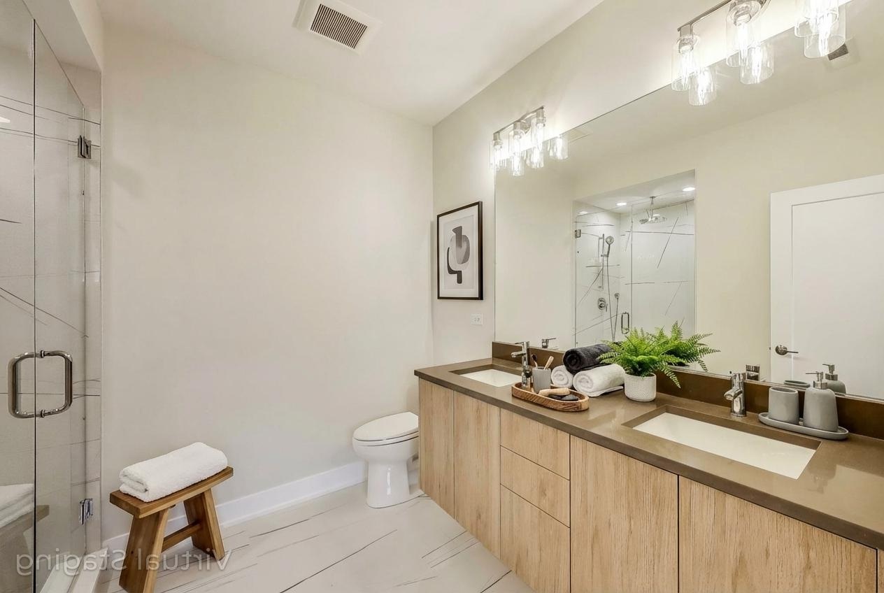 3339 North Ridgeway Avenue, Unit 2N Chicago, IL 60618 - Photo 13 of 29 a bathroom with a double vanity sink mirror and toilet