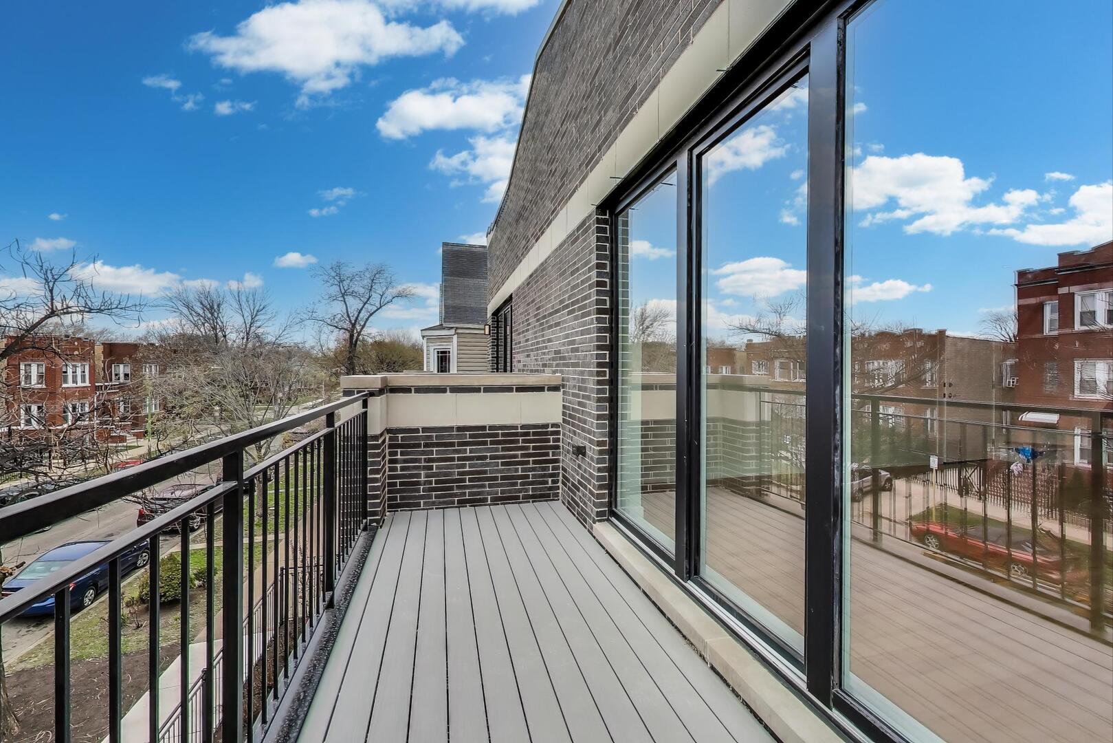 3339 North Ridgeway Avenue, Unit 2N Chicago, IL 60618 - Photo 26 of 29 a view of a balcony with wooden floor