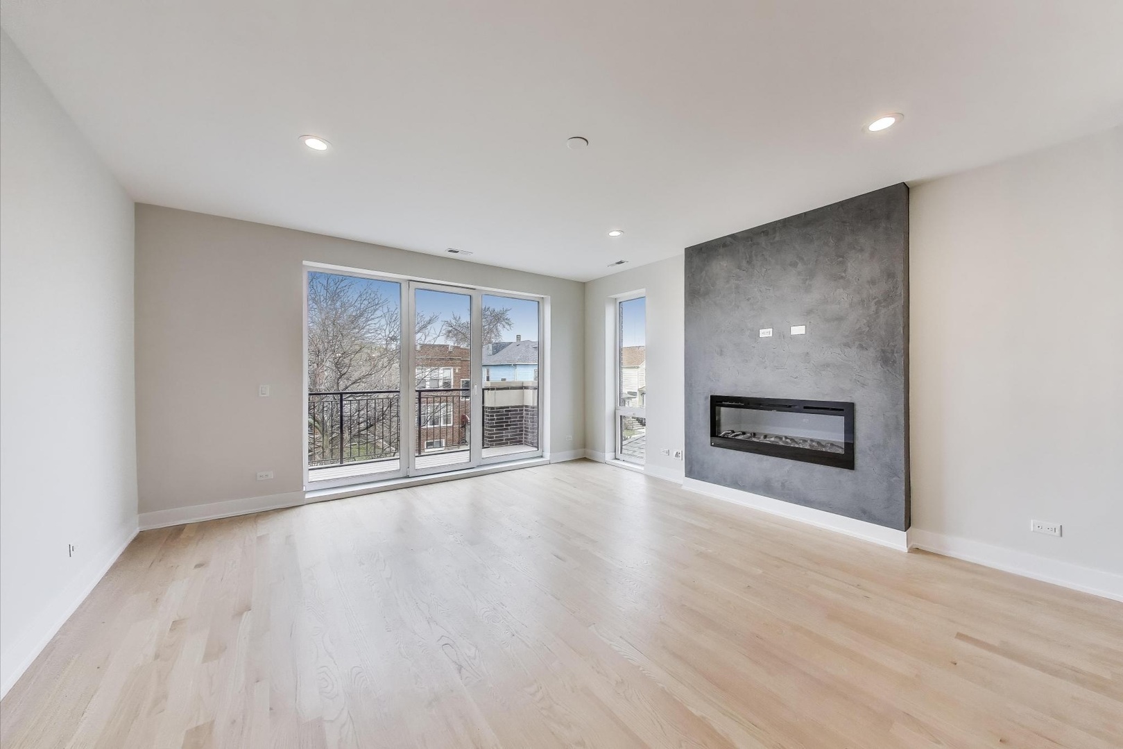 3339 North Ridgeway Avenue, Unit 2N Chicago, IL 60618 - Photo 3 of 29 a view of an empty room with a window and fireplace
