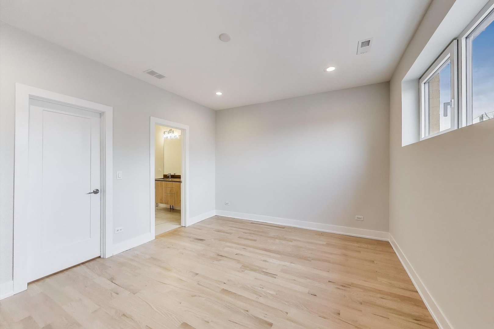 3339 North Ridgeway Avenue, Unit 2N Chicago, IL 60618 - Photo 9 of 29 a view of an empty room with wooden floor