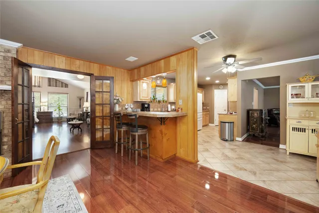 a room with lots of chairs and mirrors