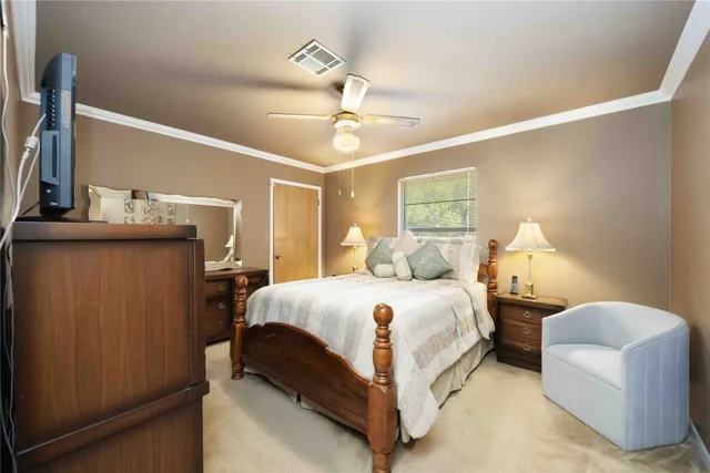 a bedroom with bed and window