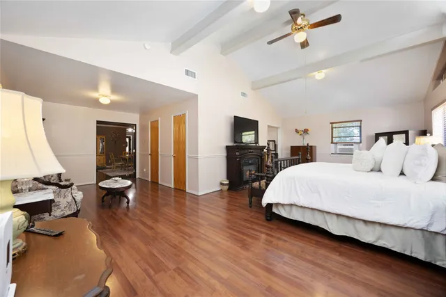 a bed room with a bed window and a television