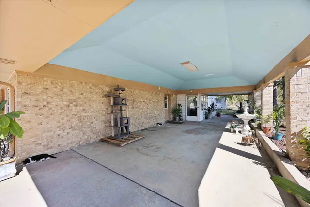 a view of a gym with trees in the background