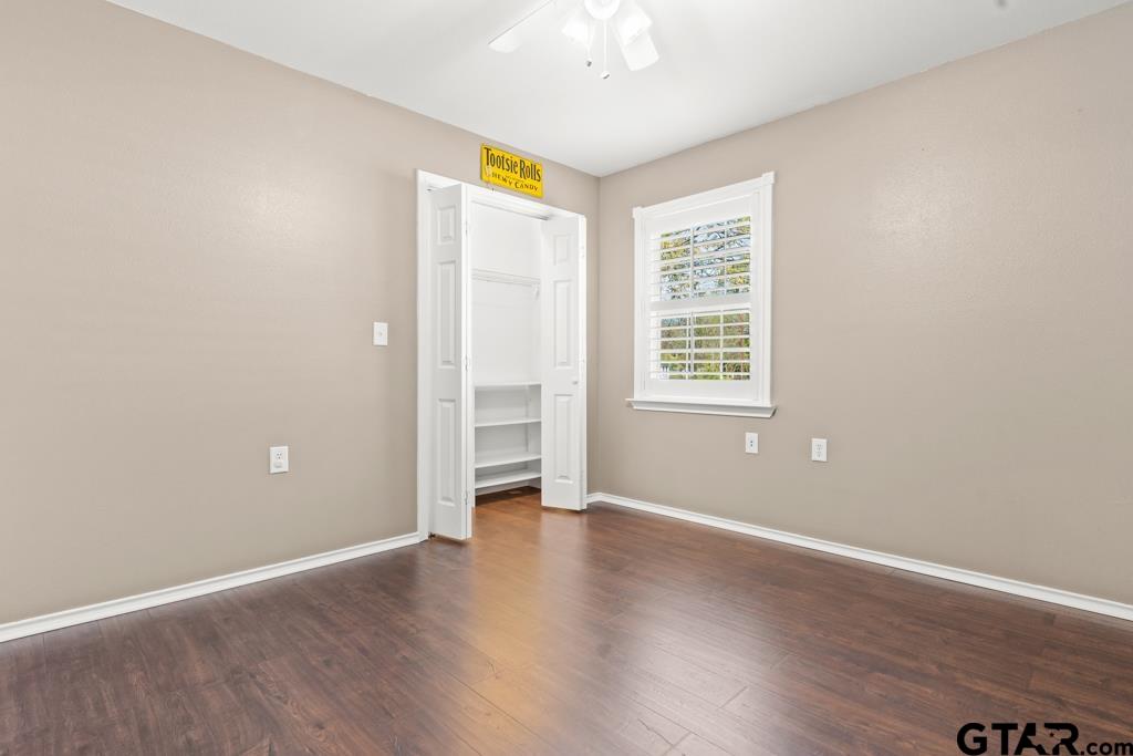 228 Cambridge Lane Longview, TX 75601 - Photo 13 of 26 an empty room with wooden floor and windows