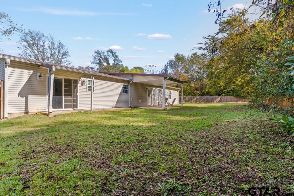 228 Cambridge Lane Longview, TX 75601 - Photo 18 of 26 a view of a house with a yard