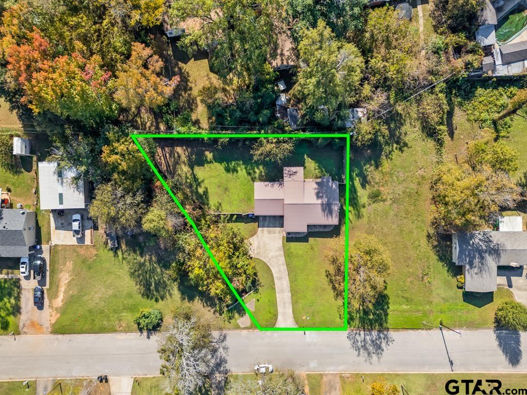 228 Cambridge Lane Longview, TX 75601 - Photo 2 of 26 an aerial view of a house with a yard basket ball court and outdoor seating
