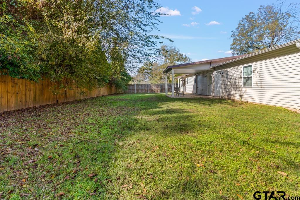 228 Cambridge Lane Longview, TX 75601 - Photo 21 of 26 a house view with garden space
