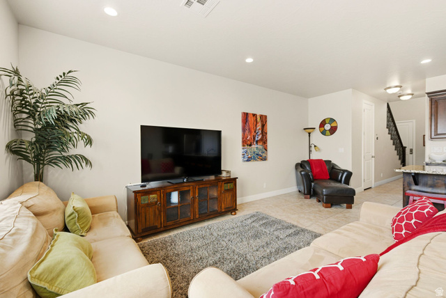 4269 Razor Drive Washington, UT 84780 - Photo 34 of 50 Living room featuring light tile patterned floors, recessed lighting, and stairs