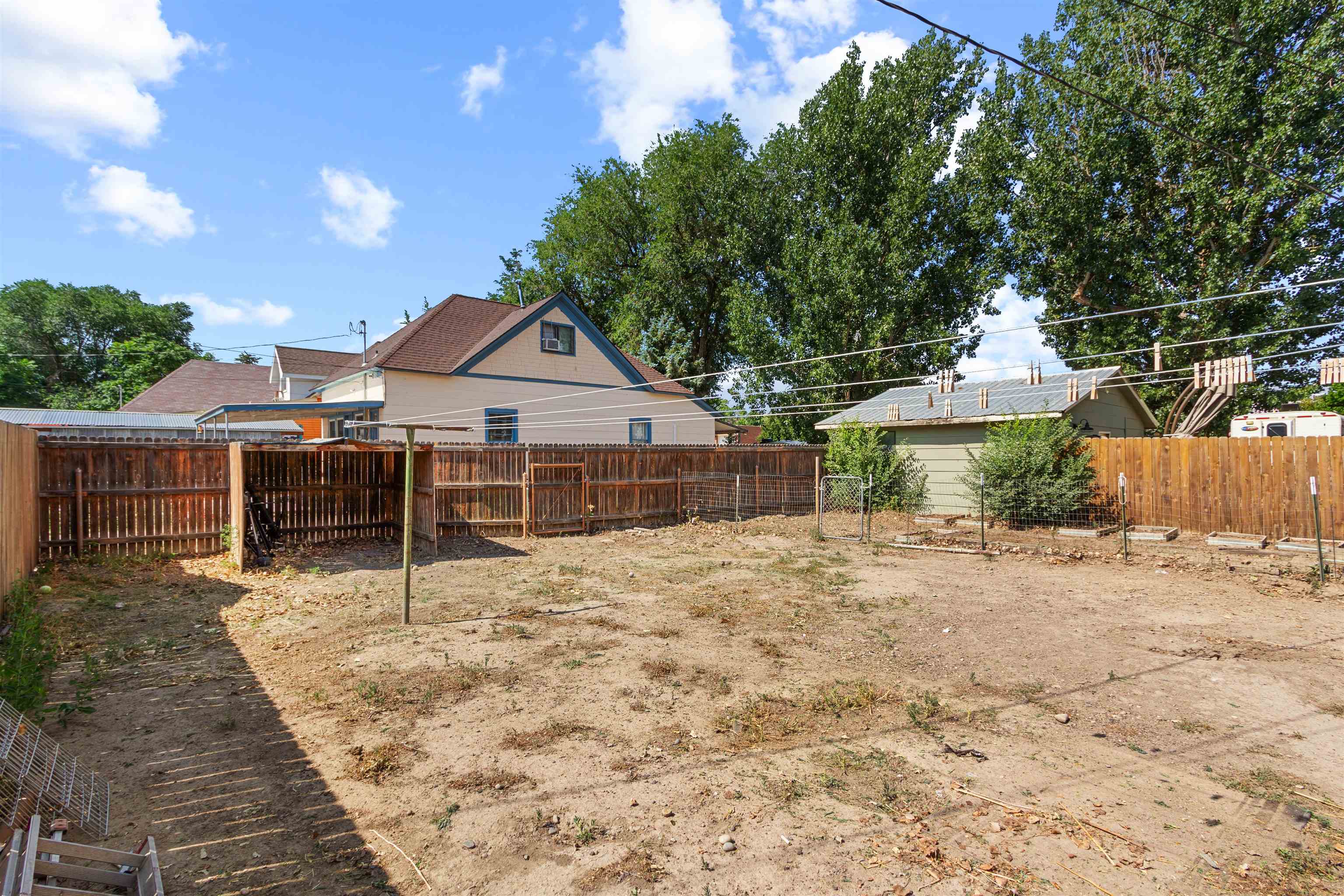 308 4th Street Delta, CO 81416 - Photo 20 of 21 a house with a bench in front of it