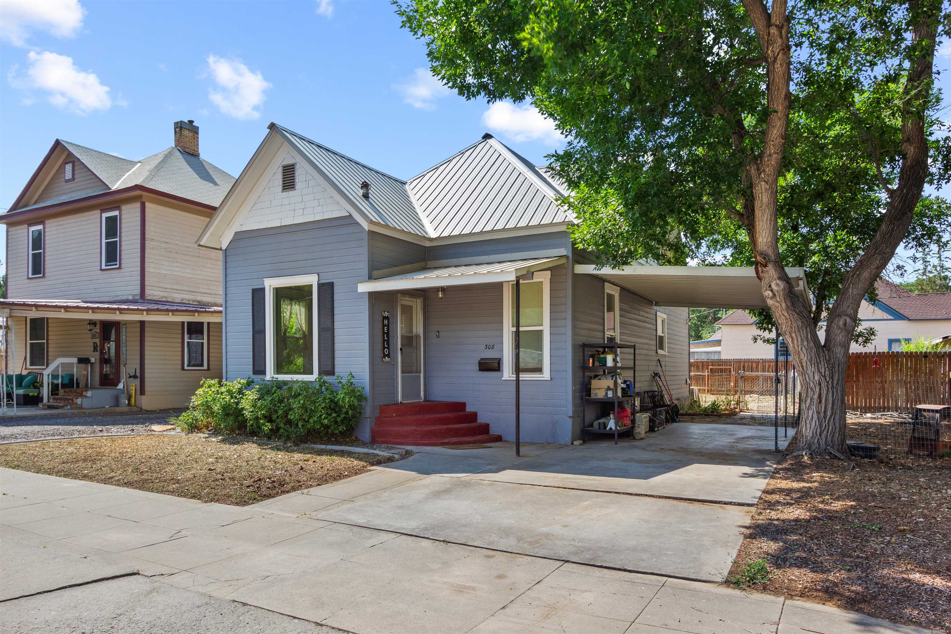 308 4th Street Delta, CO 81416 - Photo 2 of 21 front view of a house with a porch