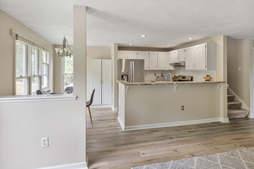 21 Midgley Lane Worcester, MA 01604 - Photo 14 of 25 a kitchen with stainless steel appliances granite countertop a stove and a refrigerator