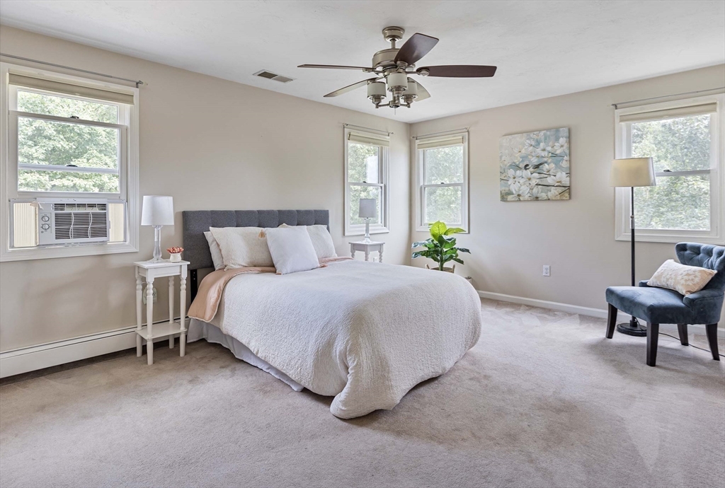 21 Midgley Lane Worcester, MA 01604 - Photo 17 of 25 a bed room with a bed and a chair