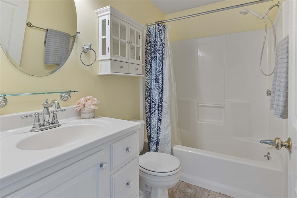 21 Midgley Lane Worcester, MA 01604 - Photo 19 of 25 a bathroom with a sink a toilet and shower