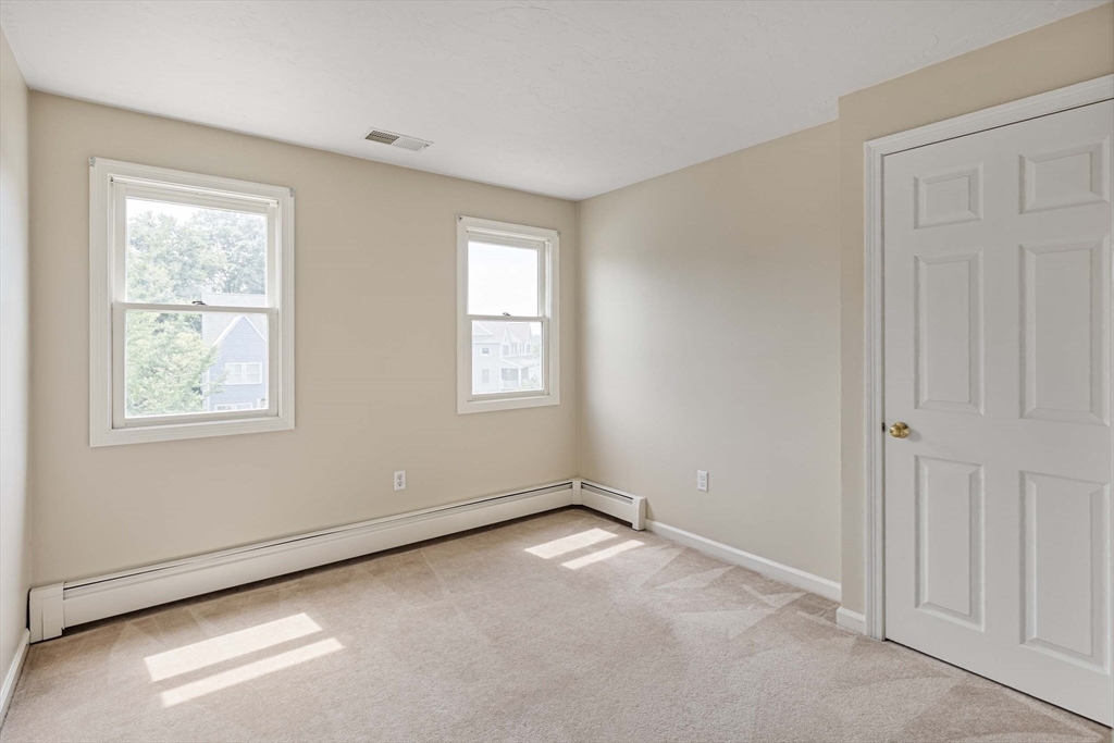 21 Midgley Lane Worcester, MA 01604 - Photo 22 of 25 an empty room with windows