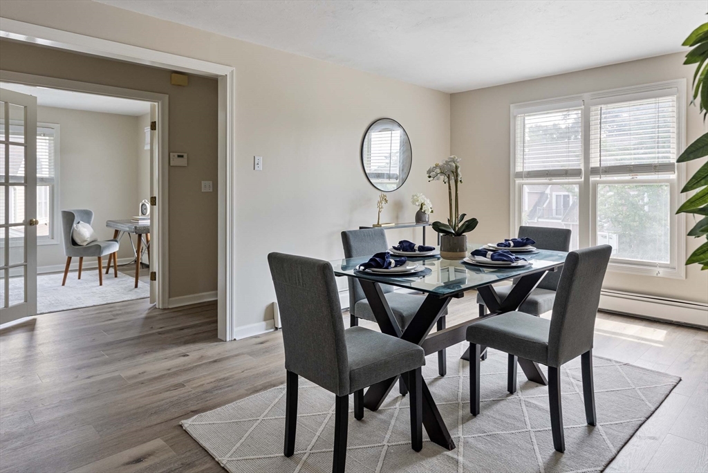 21 Midgley Lane Worcester, MA 01604 - Photo 6 of 25 a view of a dining room with furniture a chandelier and wooden floor