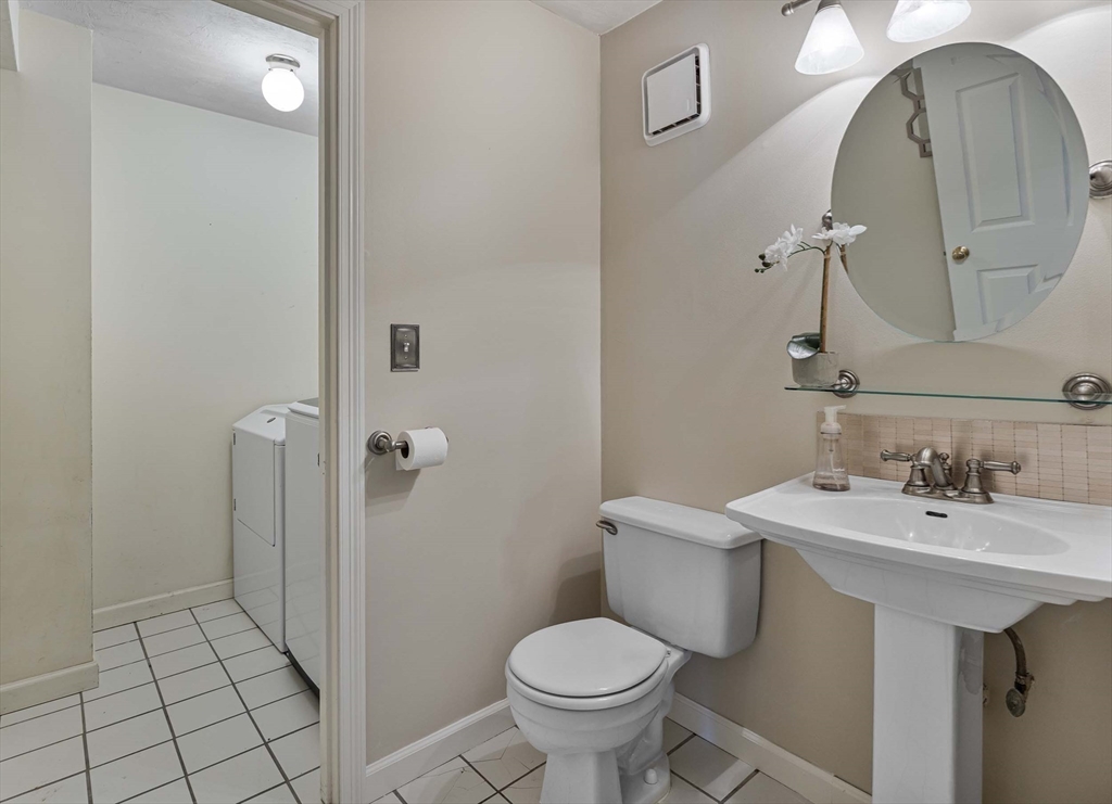 21 Midgley Lane Worcester, MA 01604 - Photo 8 of 25 a bathroom with a sink toilet and mirror