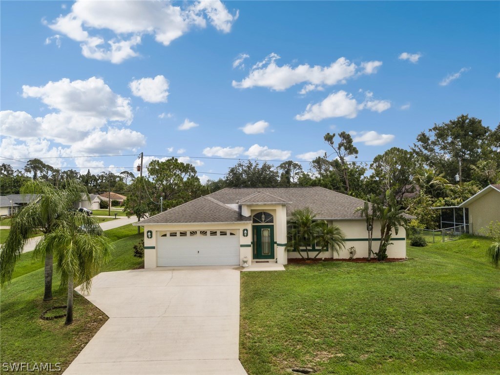 18205 Apple Road Fort Myers, FL 33967 - Photo 1 of 25 a view of a house with a big yard