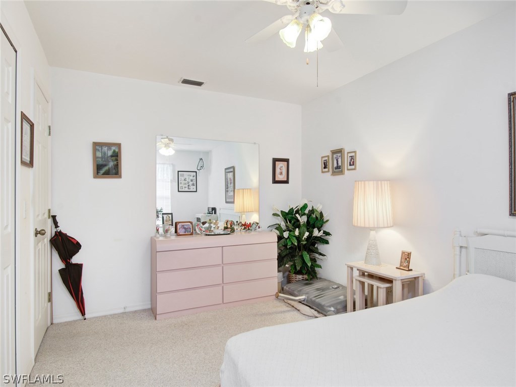 18205 Apple Road Fort Myers, FL 33967 - Photo 16 of 25 a living room with furniture and a chandelier