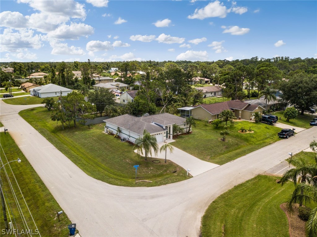 18205 Apple Road Fort Myers, FL 33967 - Photo 19 of 25 a view of a swimming pool with a yard