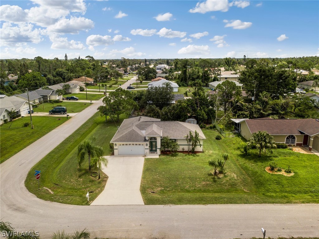 18205 Apple Road Fort Myers, FL 33967 - Photo 2 of 25 an aerial view of a house with a yard