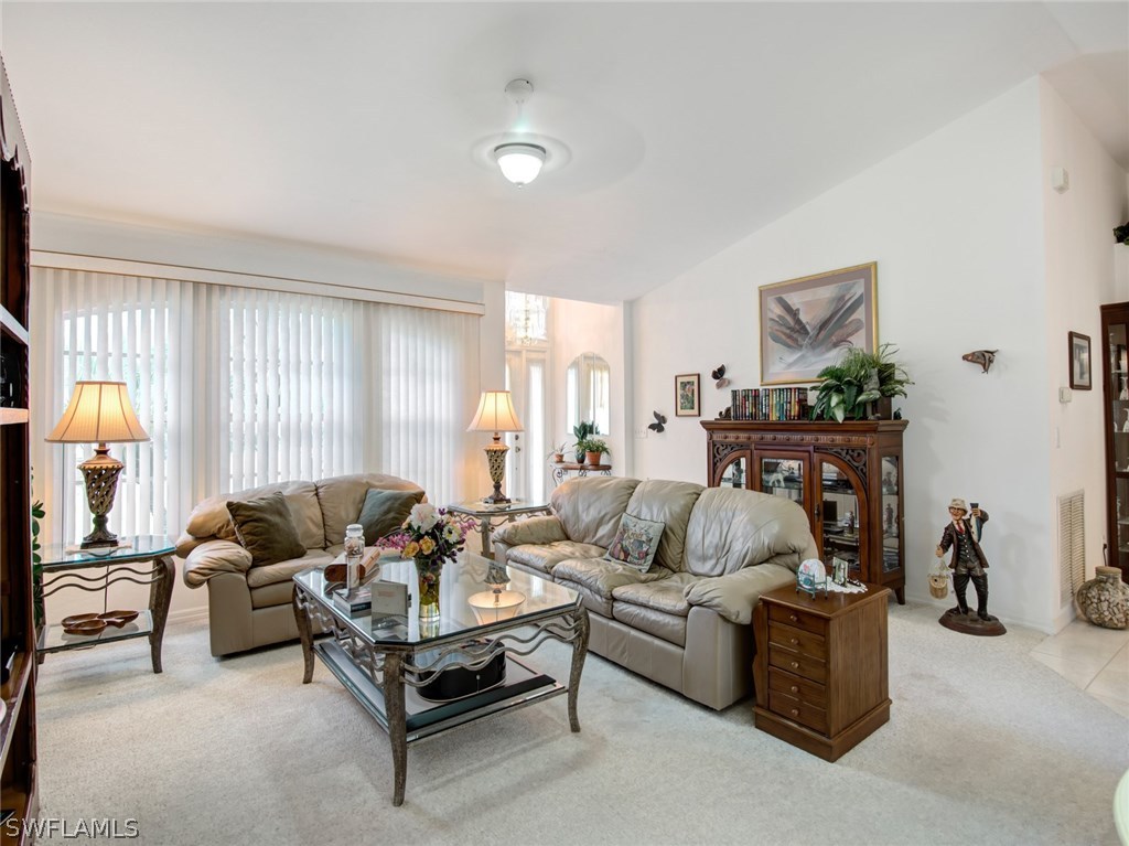 18205 Apple Road Fort Myers, FL 33967 - Photo 5 of 25 a living room with furniture and a large window