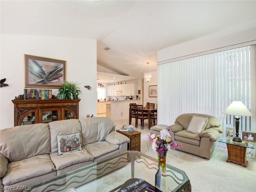18205 Apple Road Fort Myers, FL 33967 - Photo 6 of 25 a living room with furniture and a lamp