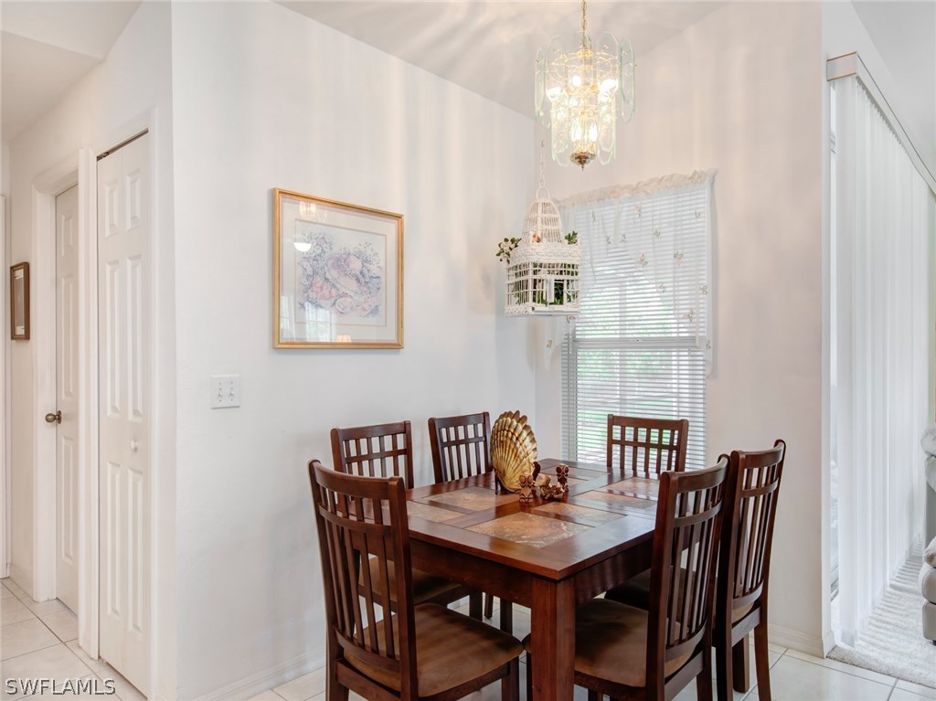 18205 Apple Road Fort Myers, FL 33967 - Photo 7 of 25 a view of a dining room with furniture window and outside view