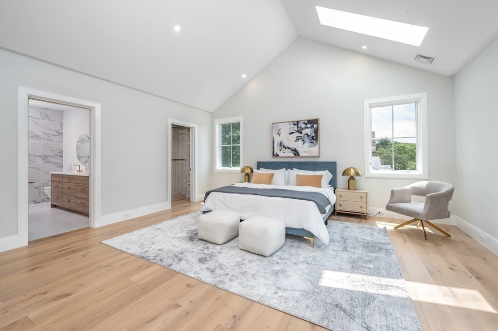 142 Bellingham Road Chestnut Hill, MA 02467 - Photo 18 of 37 a bedroom with a bed and wooden floor