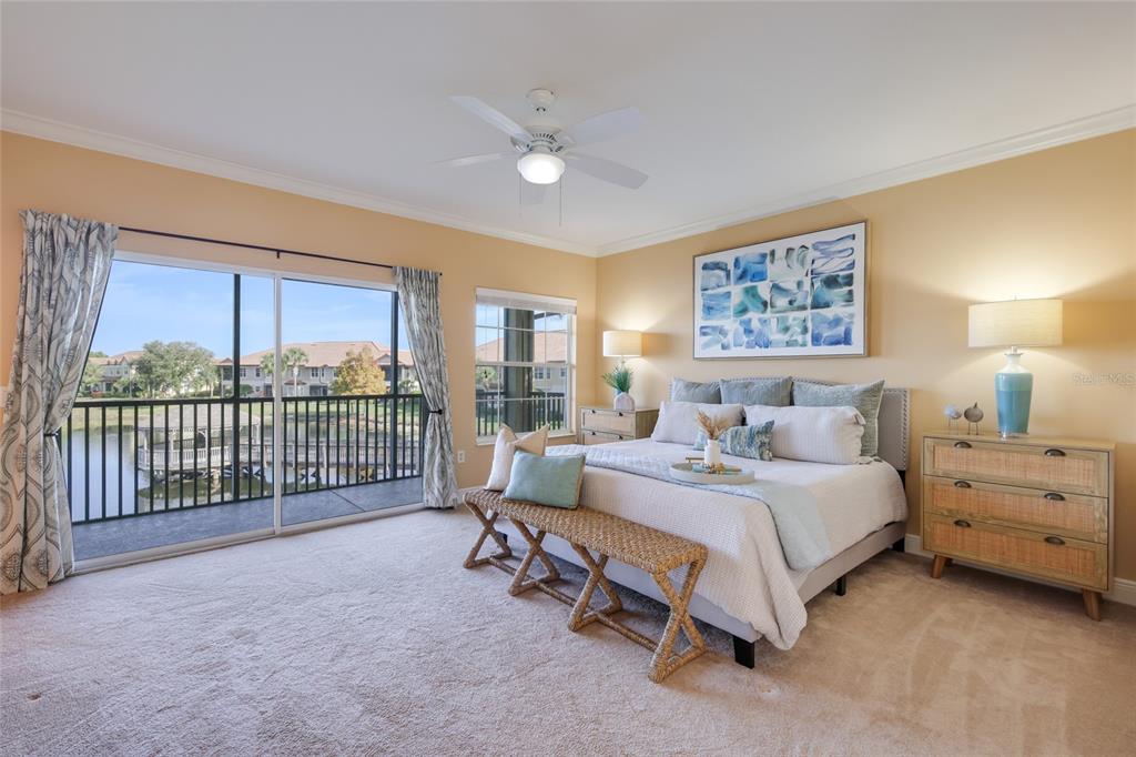 8336 Miramar Way Lakewood Ranch, FL 34202 - Photo 22 of 63 a spacious bedroom with a bed and a large window