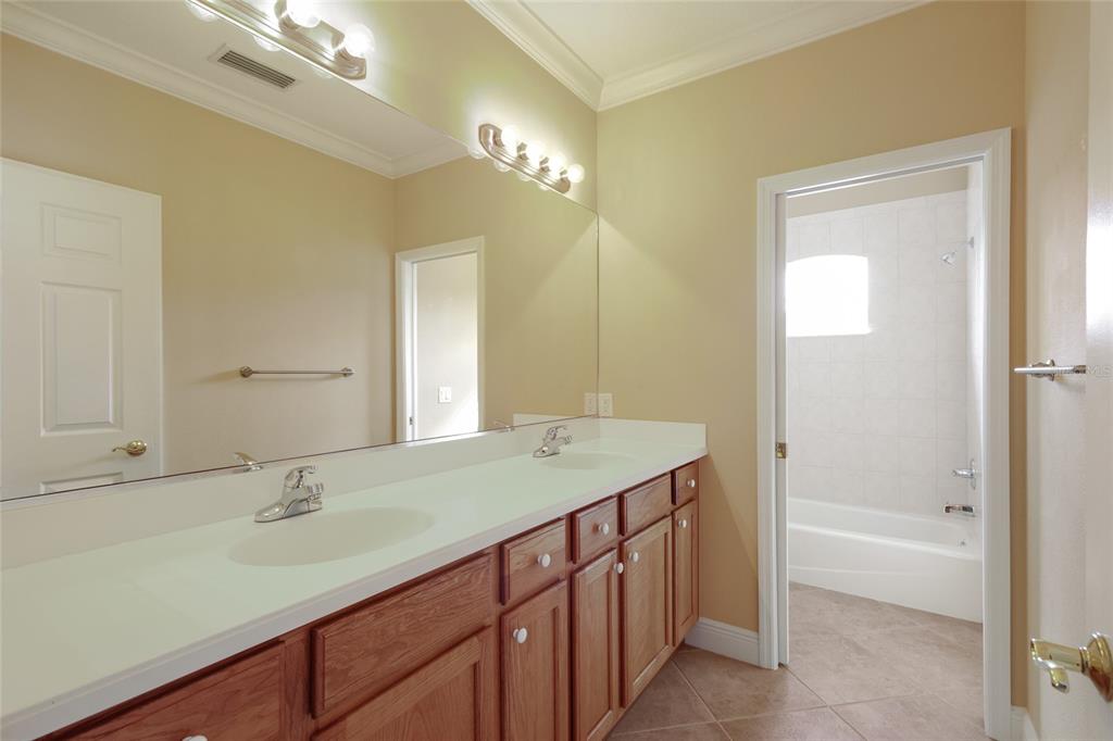 8336 Miramar Way Lakewood Ranch, FL 34202 - Photo 31 of 63 a bathroom with a granite countertop sink and a mirror