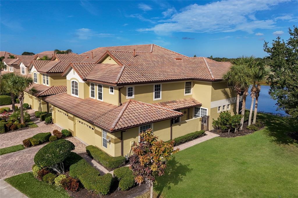 8336 Miramar Way Lakewood Ranch, FL 34202 - Photo 38 of 63 a aerial view of a house with a garden and plants