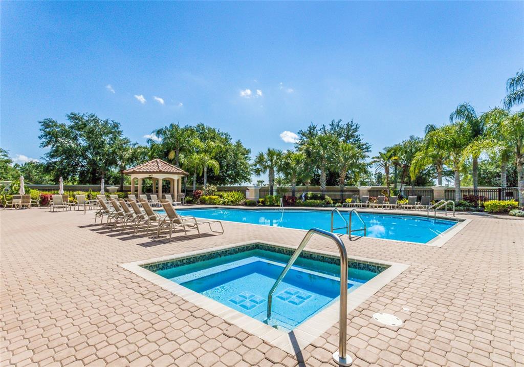 8336 Miramar Way Lakewood Ranch, FL 34202 - Photo 50 of 63 a view of a swimming pool with an outdoor space and seating area