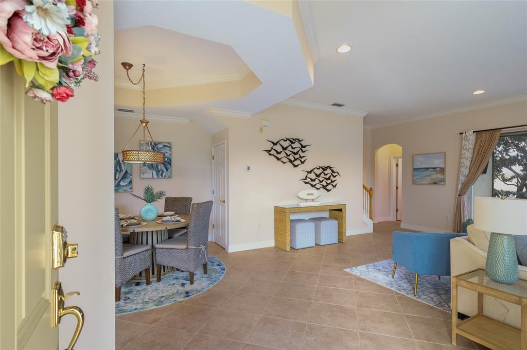 8336 Miramar Way Lakewood Ranch, FL 34202 - Photo 9 of 63 a living room with furniture and a table