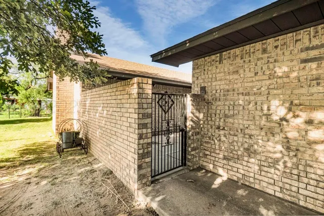 a view of a backyard of the house